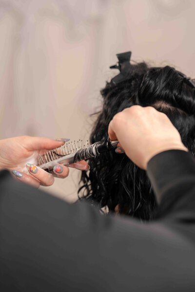 women getting hair styled