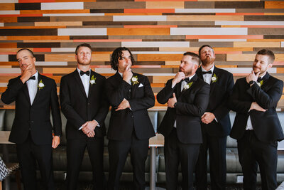 groom standing with groomsmen