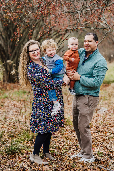 boston family snuggles on blanket during winter photoshoot