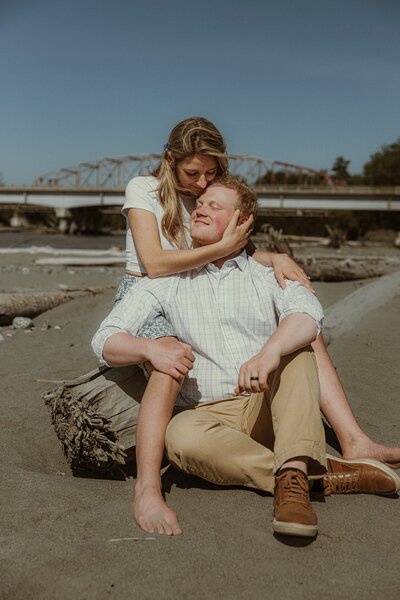 A couple embraces during a couples session at the Matanuska River Flats