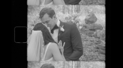 Black and white super 8 video still of a couple kissing at their blenheim, NY wedding.
