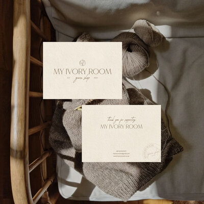 Thank you card design on top of image of knitting