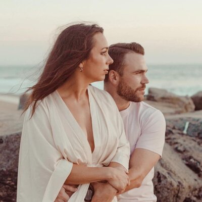 beautiful couple takes romantic engagement photos on the beach