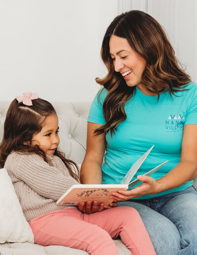 Nanny Village Nanny reading to child