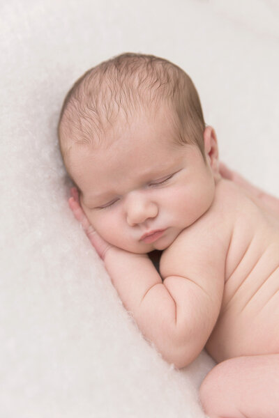 Newborn baby boy sleeping during his Raleigh newborn photography session