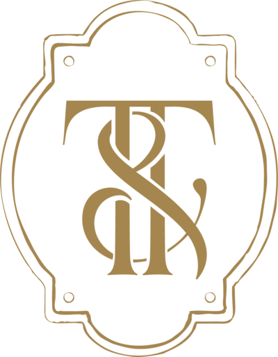 Submark logo of Ivory and Tweed in gold