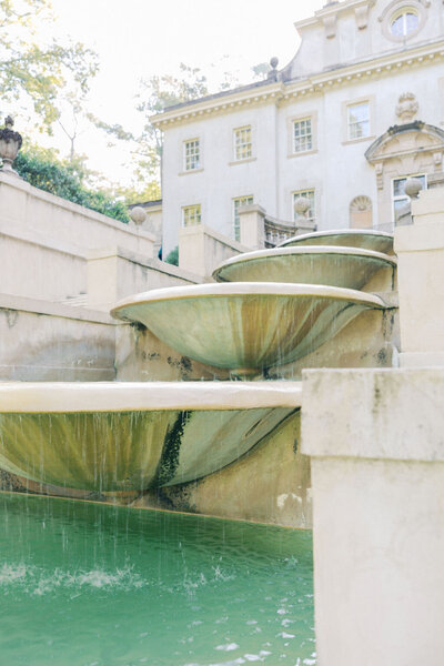 Rear of Atlanta History Center Swan House fountains descend down steps with moving water