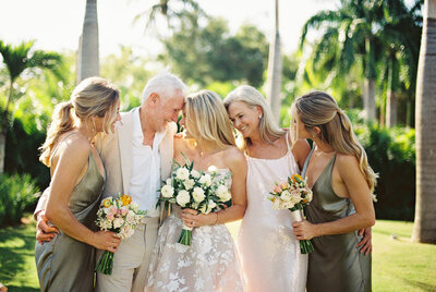 Bride surrounded by family and bridesmaids after the ceremony at Teeth of the Dog Golf Course in Casa de Campo — joyful, candid moment by Asia Pimentel Photography.