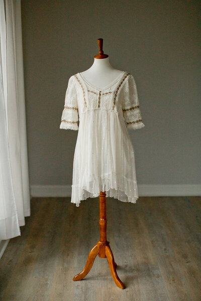 short free people dress with ¾ sleeves in white with gold thread detail