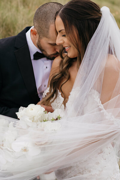 bride and groom embracing