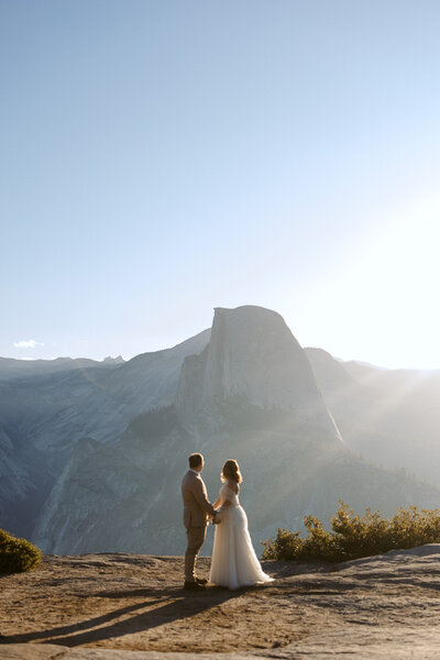 An image of a couple on Glacier Point in Yosemite at their elopement by Chris Tack