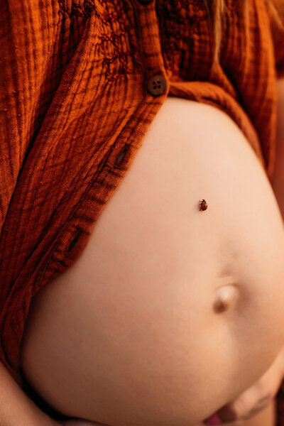 Close-up of baby bump during Scottsdale maternity photo session