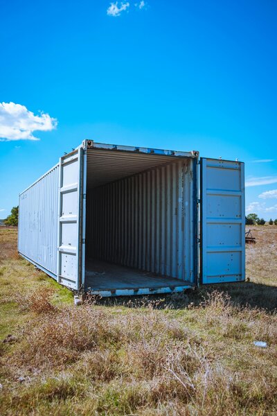 Blue storage shipping container in field for sale in New Mexico