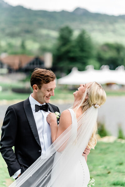 Bride and groom laugh