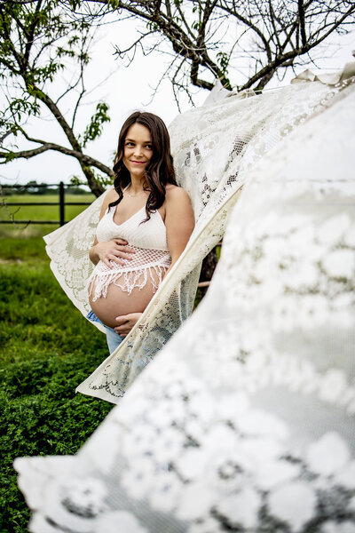 An expectant mom at a maternity photo shoot at Lake Grapevine in Southlake Texas