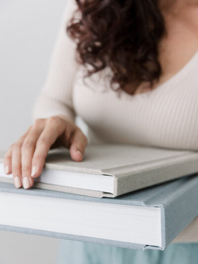Client holding albums