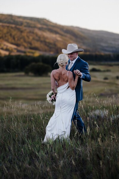 Bride and groom enjoy sunset dance  during stress-free Colorado micro wedding.