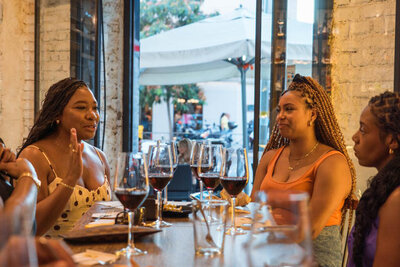 A group of women enjoying Wine Guide Madrid's Tapas and Wine Experience.