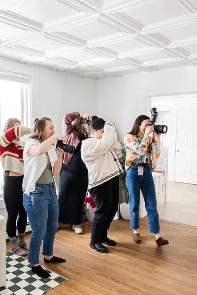 group of women photographers taking pictures