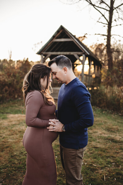 Celebrate the journey to parenthood with a stunning outdoor maternity photoshoot in Connecticut. This heartwarming image captures the love and anticipation of expecting parents in a scenic nature setting. Book your couples maternity photography session with Nicole Mele Photography for timeless and emotional portraits.