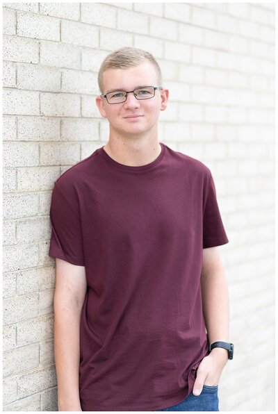 High school senior sits in front of his plane for Hamilton Montana senior photos