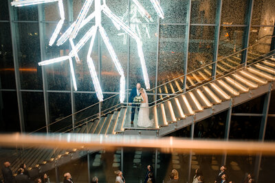 bride and groom walking down stairs