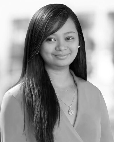 Woman with long dark hair and necklace Vice President Operations