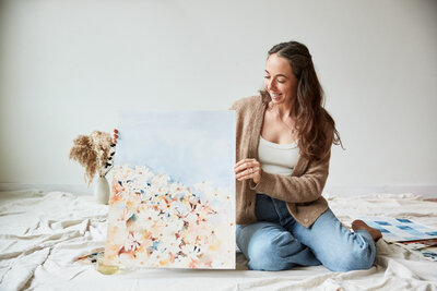 jaime paints loose watercolor florals in neutral minimalist colors cascading down the page