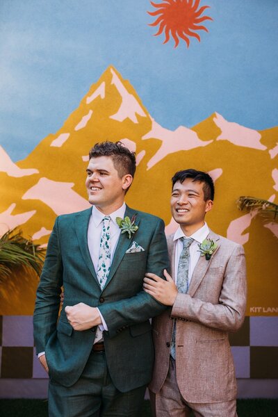 two grooms smiling at No Vacancy