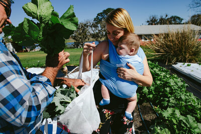 Mom at Farmers Market carrying her baby