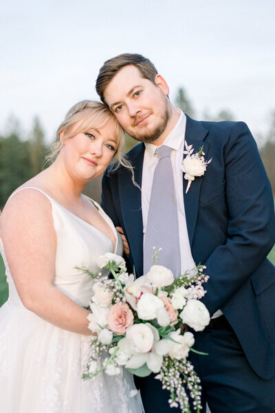 Bride and groom sharing groom dipping bride and smiling at each other taken by spokane wedding  photography