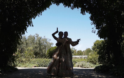 Couple on wedding day in traditional Indian Clothes dancing together in amazing location near Melbourne