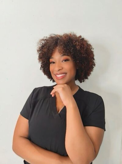 Photo of Sarina Dorsinvil, LMT, Licensed Massage Therapist at Refined Medical NY in East Setauket Long Island, providing patient massage and wellness services.