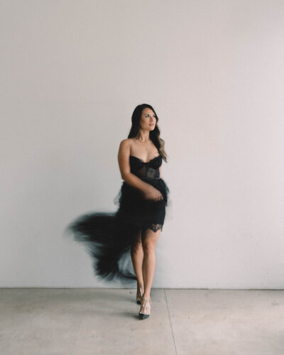 Cat Lauren Calligraphy in a black lace and tulle dress
