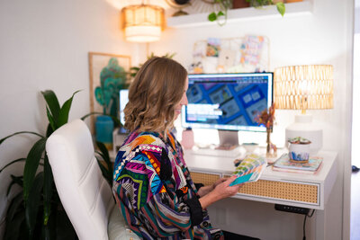 Showit Designer Micaela Working in her home office - Create & Wander