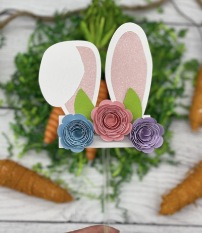 Easter bunny cake topper with rabbit ears and flowers