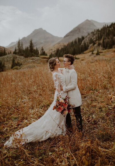 Bride's snuggle together in the Colorado mountains