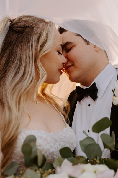 bride and groom holding hands