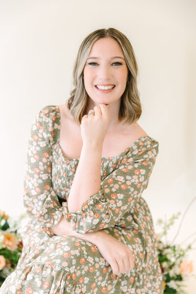 Amy Jordan Photography headshot at studio wearing a green floral dress