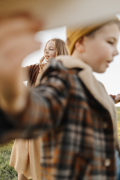 siblings flying air planes