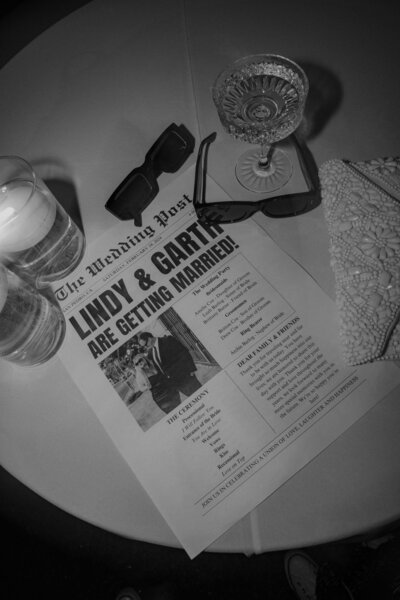 Custom wedding newspaper featuring Lindy and Garth’s announcement, styled by Beyond the Event as a unique reception detail.