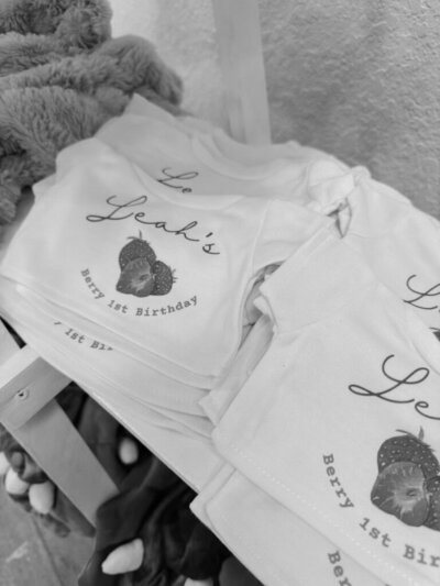 Black and white image of berry themed party merch for birthday party planned by Fancy Chancey in San Diego CA