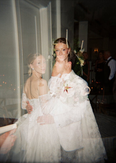 a film photo of a bride and groom at their wedding reception
