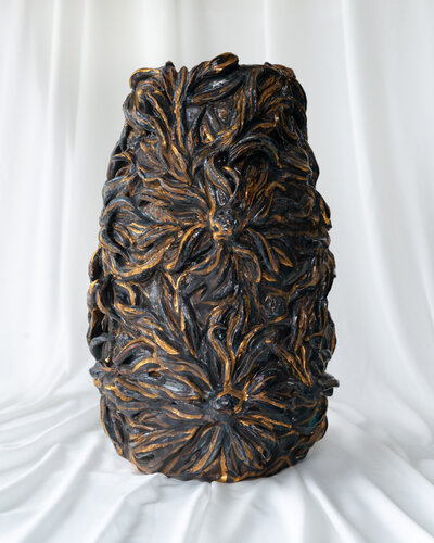 Handmade ceramic sculpture of an elegant figure by Gerda Satunas, captured with high-quality product photography.
