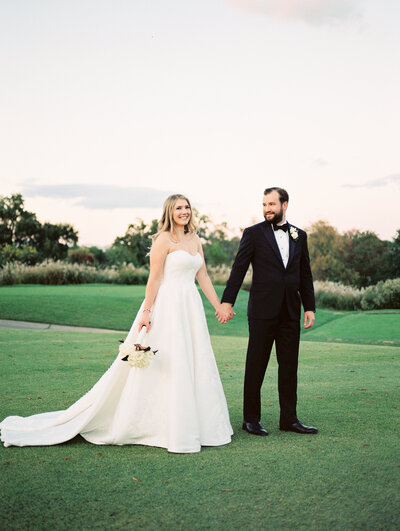 Bride and Groom portraits by a fountain in Maryland venue