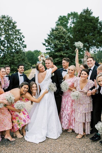 A bride and groom smile at the camera for an asheville wedding photographer