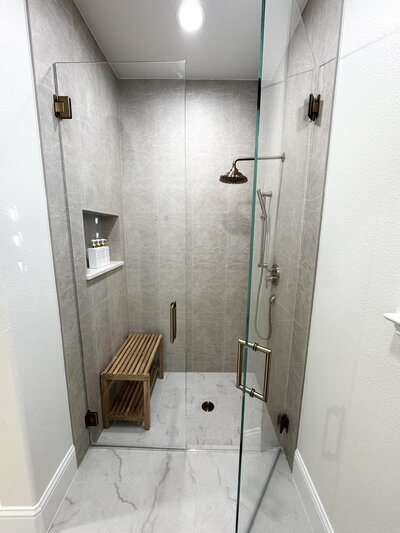 Tailored interior design services for your home with a bathroom project featuring elegant materials, sleek fixtures, and a modern, sophisticated design.