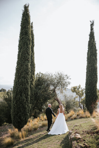 Italy wedding day bliss: couple in Tuscany, captured in a moment of pure joy.