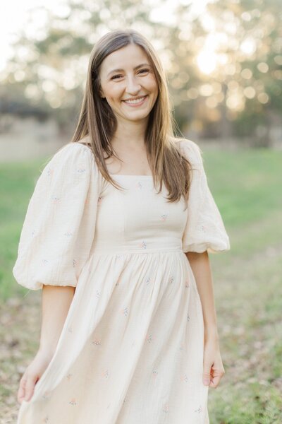 Houston family photographer Allie Nichols smiling and camera