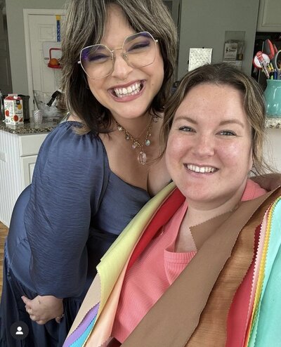 Susan smiling with a client draped in seasonal color swatches during a personal color analysis party in New Jersey